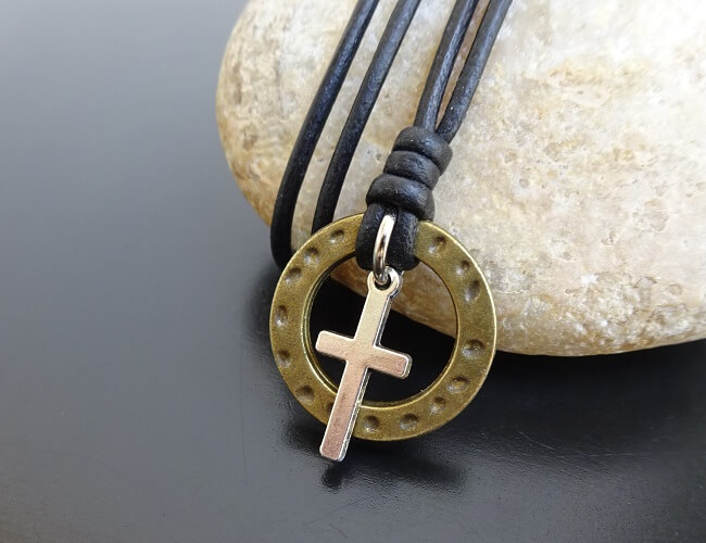 cross pendant on leather
