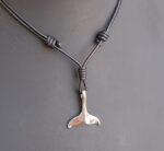 polished stainless steel whale pendant slip knot