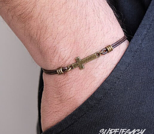 bronze cross bracelet worn