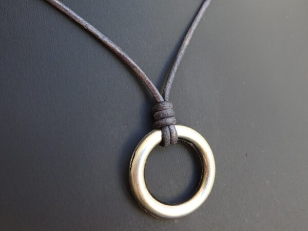 ring necklace on gray leather website