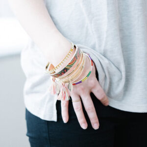 Woman wrist with stack bracelets