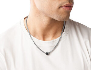 male wearing a pendant over a t-shirt