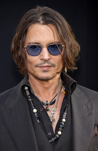 jhonny deep wearing multiple necklaces