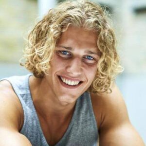 blond man with Curly Surfer Hair